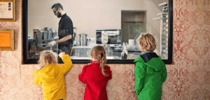 Children watch chocolate being made