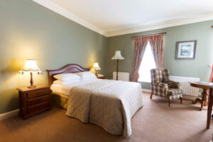 Luxury bedroom at Sheedy's Hotel, reunite, visit